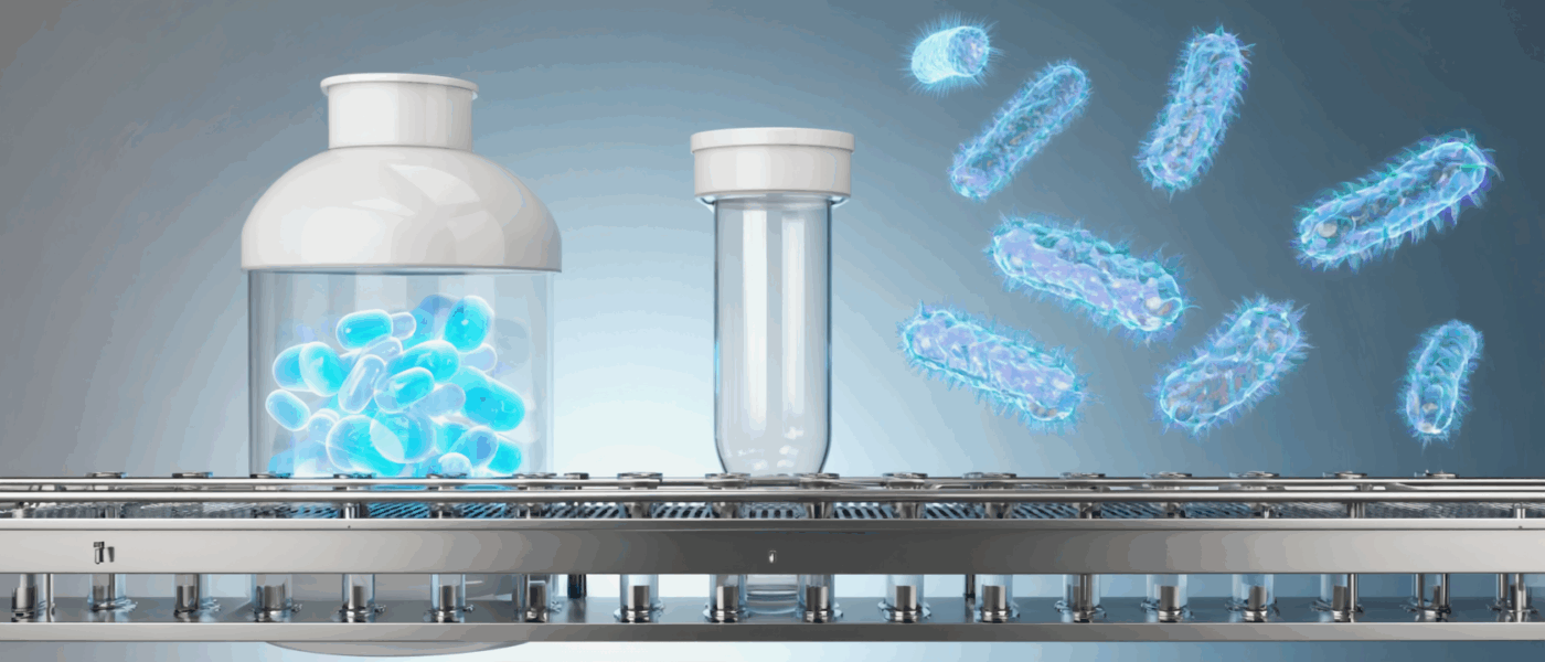 A 3D rendering of a manufacturing process for probiotic health products, showing a bottle filled with glowing blue capsules, an empty test tube on a conveyor belt, and several glowing blue bacteria-like organisms floating in the background.